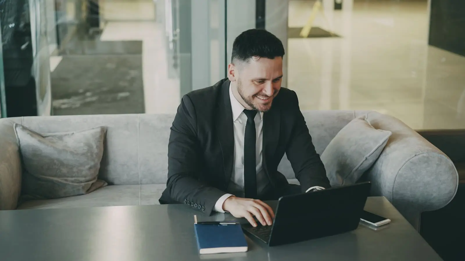 Professional reviewing financial planning on laptop, illustrating the high-earner setup for executing a mega backdoor Roth strategy