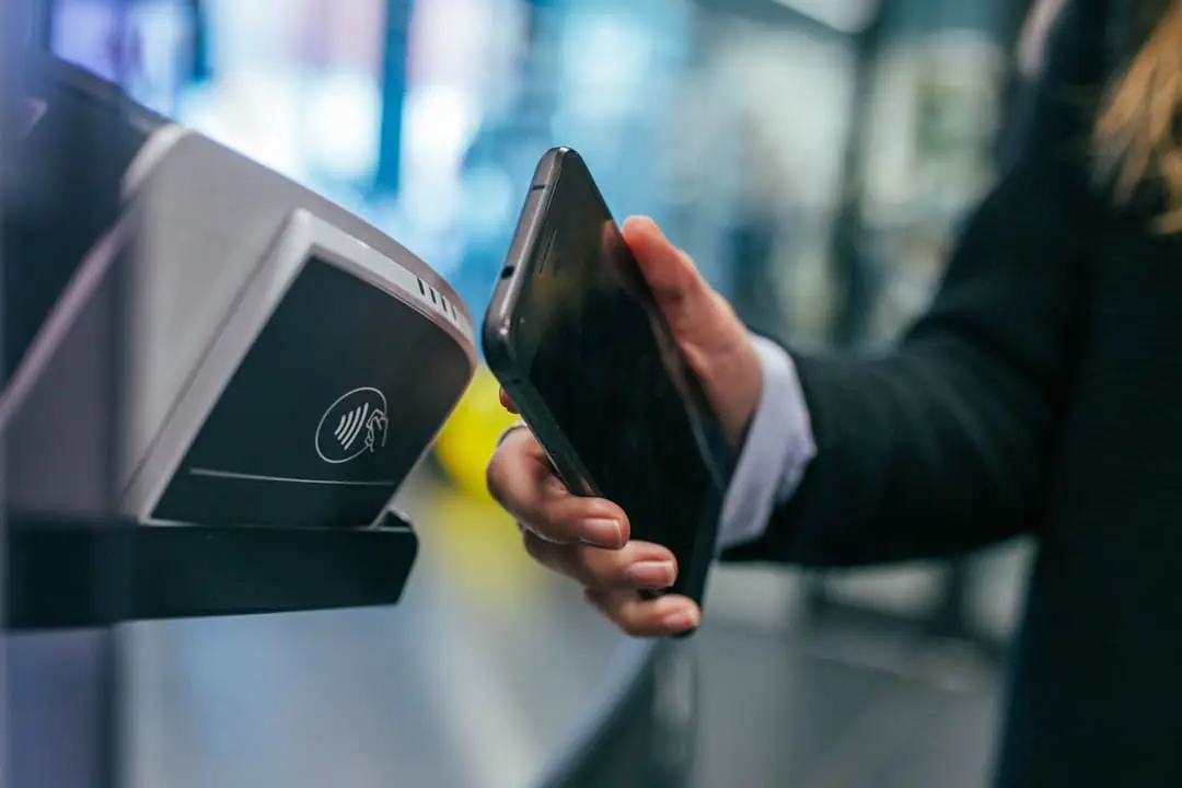 A smartphone showing a buy now pay later checkout option representing UK and US BNPL regulation