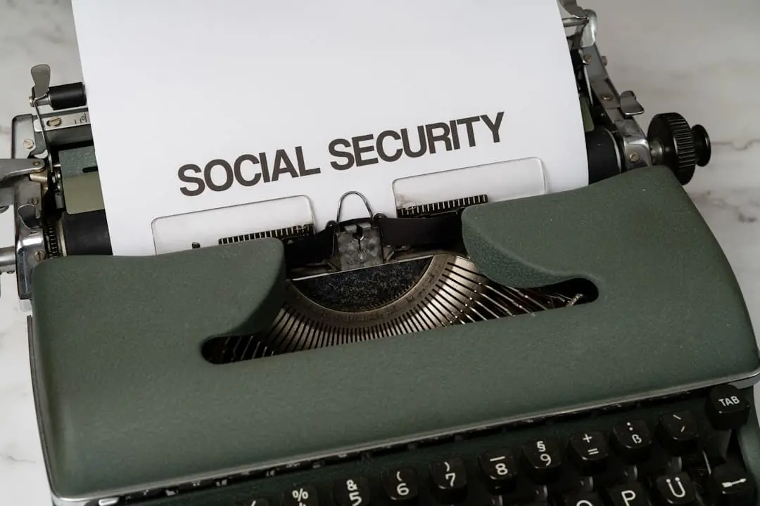 A US Social Security check and calculator on a desk representing the 2027 COLA and Trust Fund picture